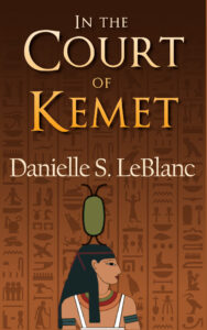 In the Court of Kemet historical fiction novel of Ancient Egypt. On the cover is an Egyptian goddess and hieroglyphics